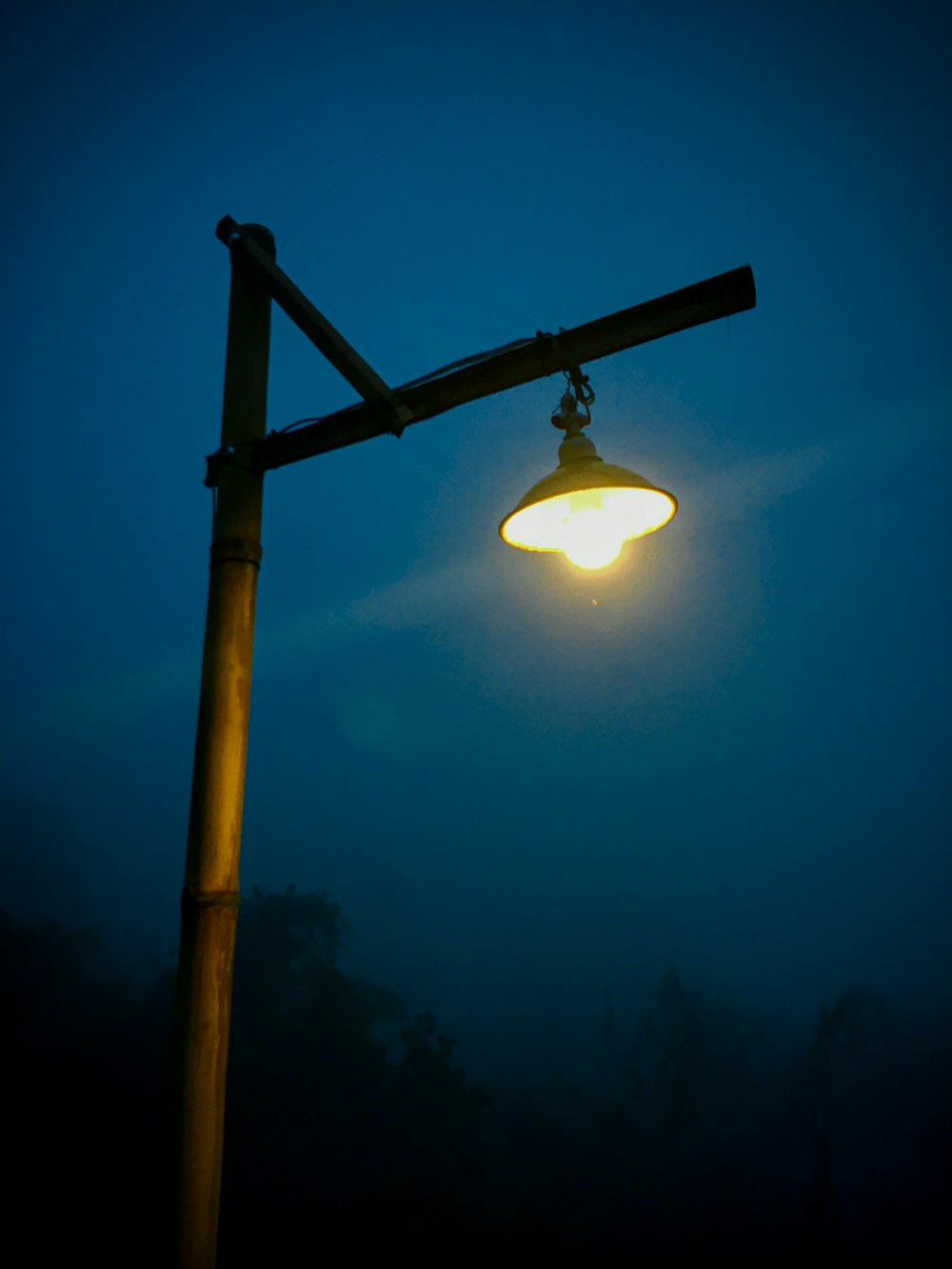 a street light with a blue sky