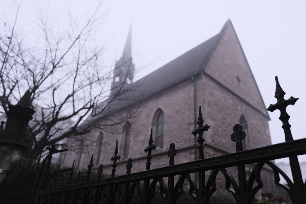 a church with a black fence