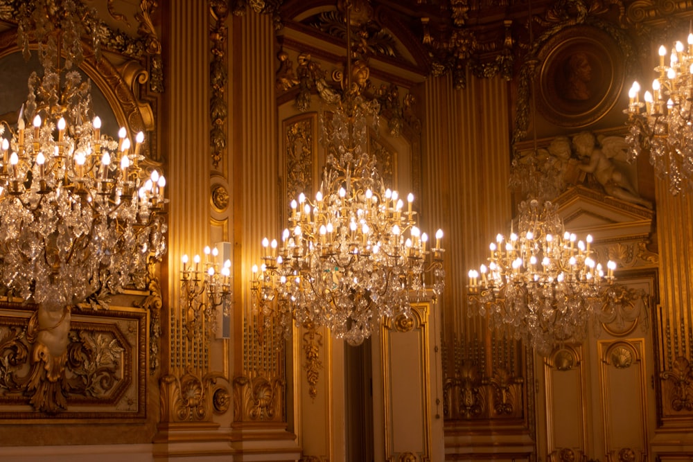 a room with chandeliers and a staircase