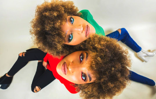 a couple of girls posing for the camera