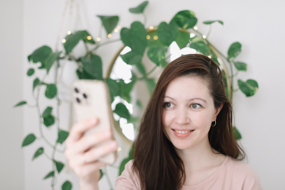 a person holding a photo taking headshot at home