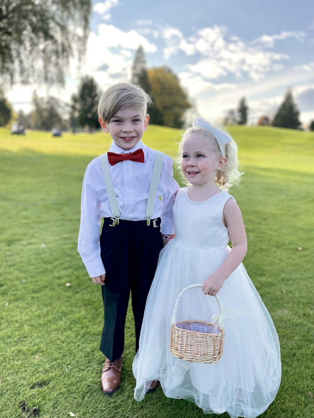 a boy and girl in formal wear