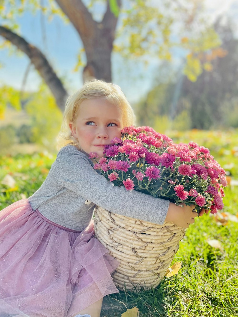 a girl holding a flower
