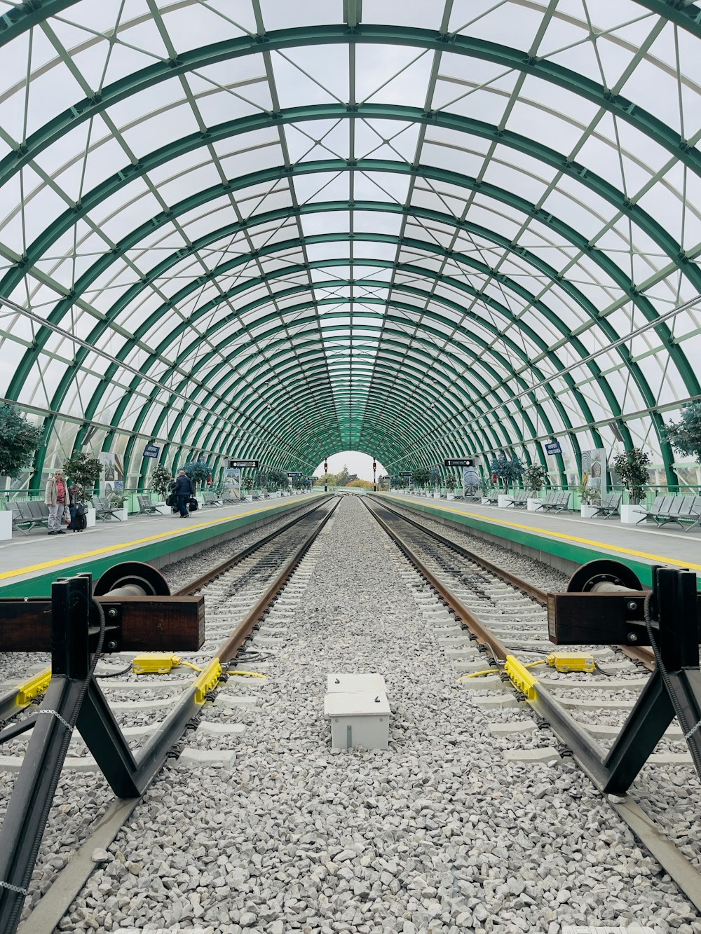 a train station with a large glass roof