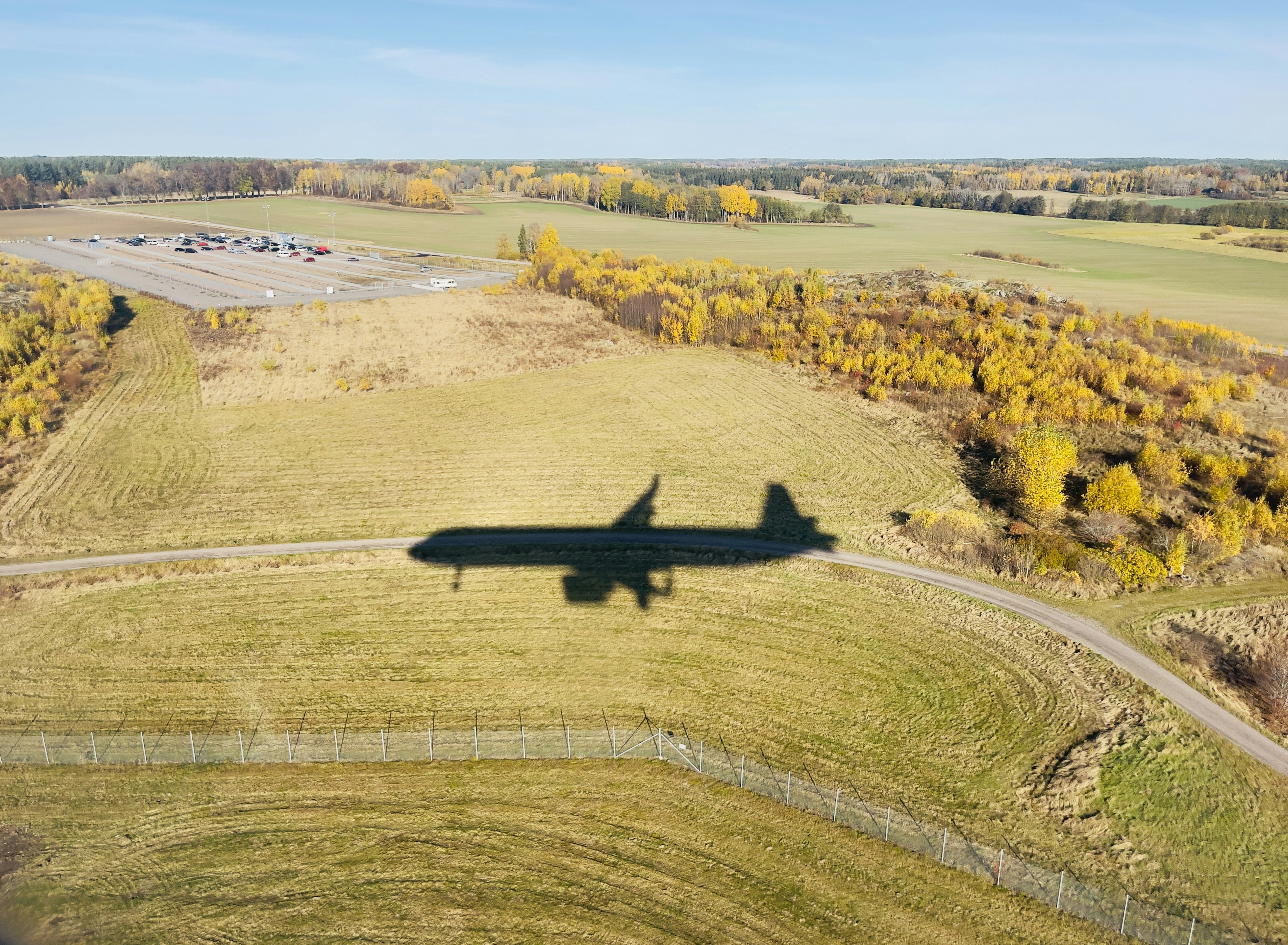 A road in a field photo – Free Airplane Image on Unsplash