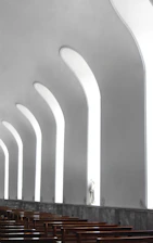 Clean corporate workspace with subtle faith-inspired architectural elements.