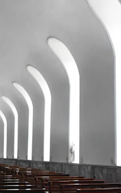 Clean corporate workspace with subtle faith-inspired architectural elements.