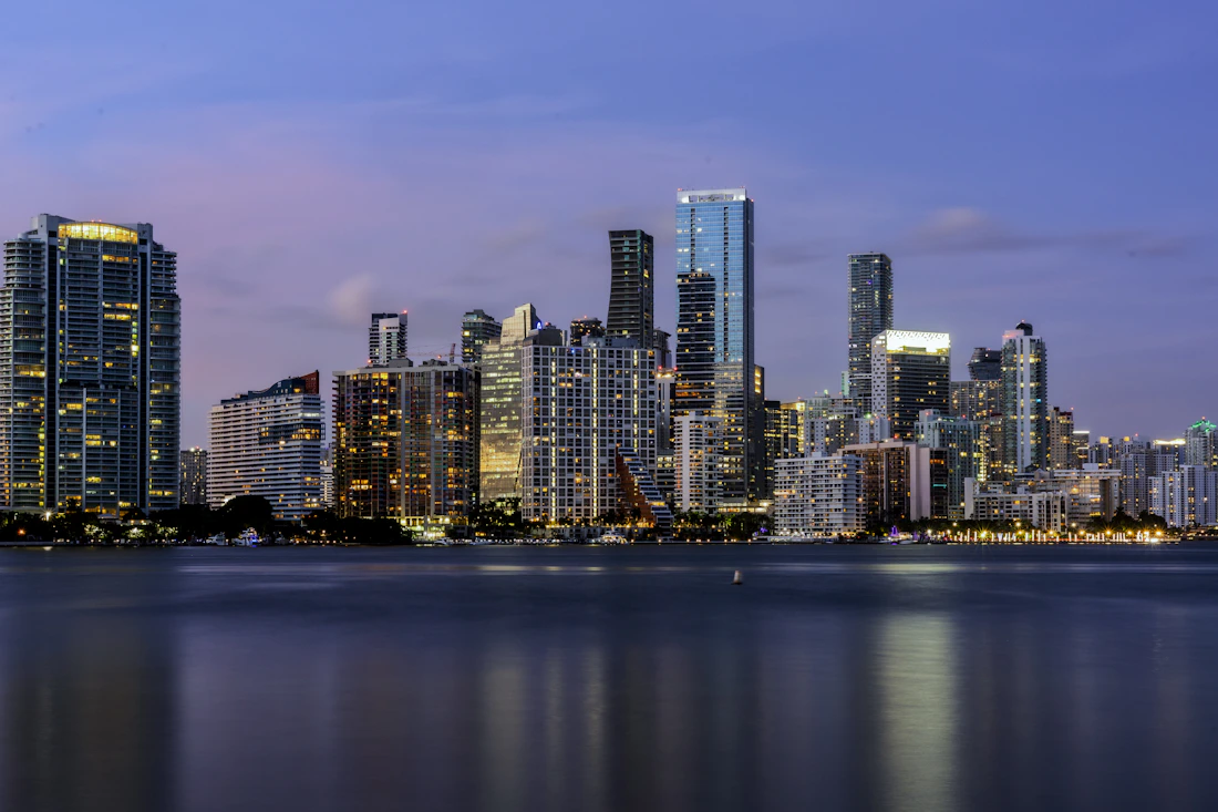 Downtown Miami skyline across Biscayne Bay at dusk