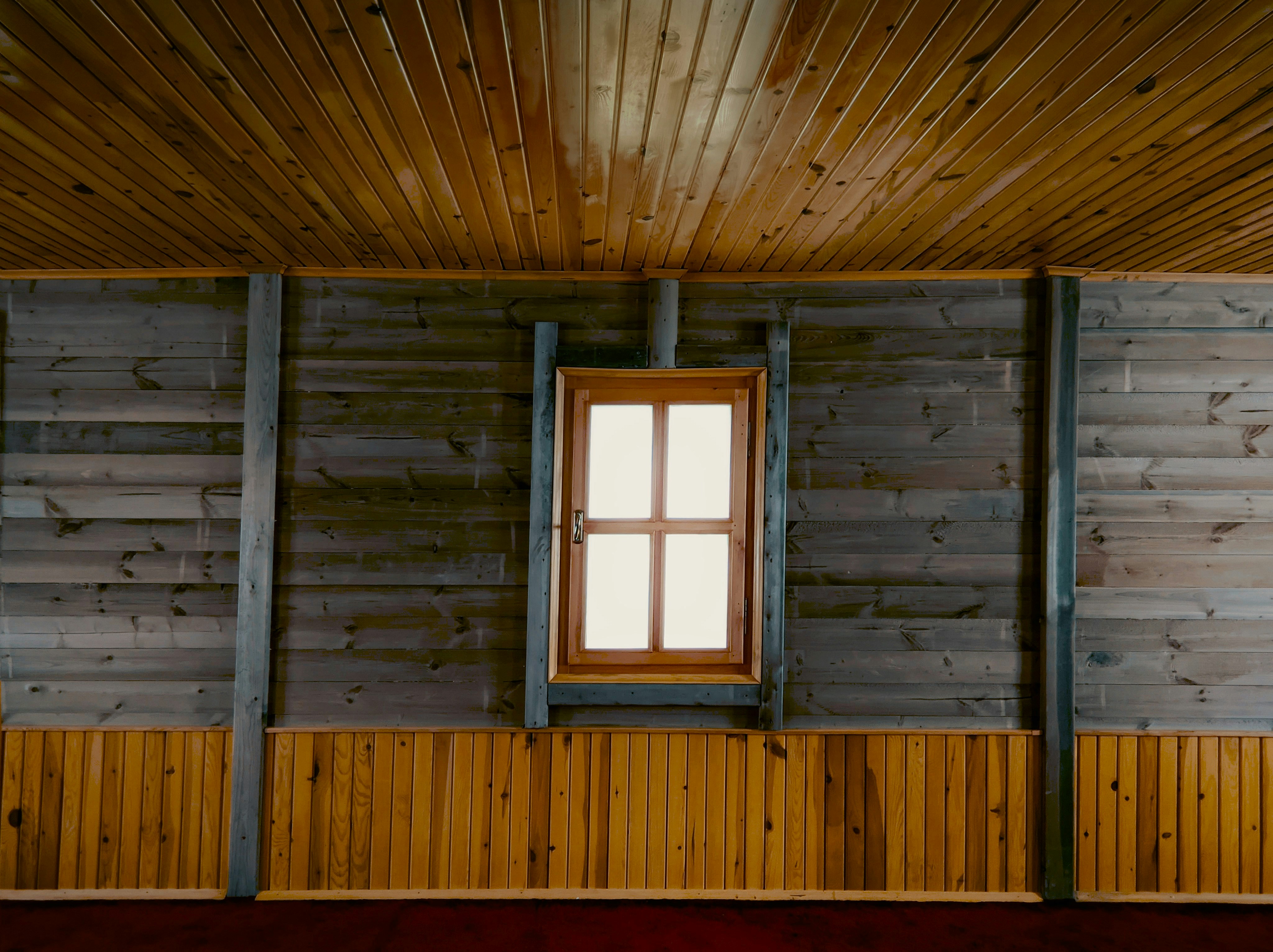 a window in a wooden building