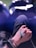 a person's hand holding a black object