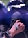 a person's hand holding a black object