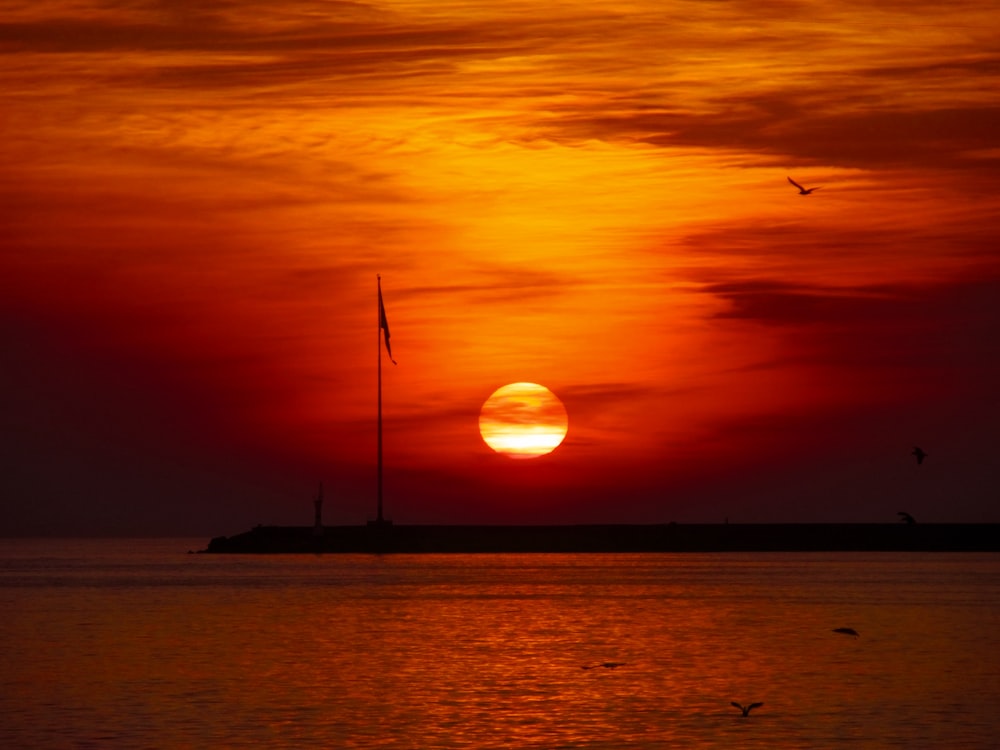 a sunset over a body of water