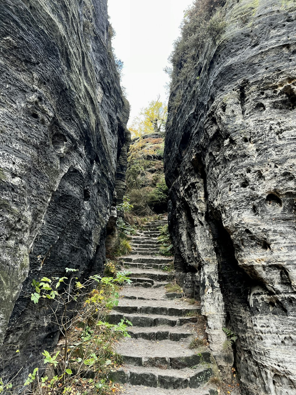 a stone staircase between two large rocks