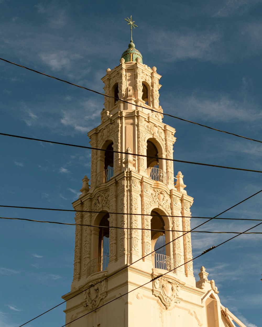 a tall building with a cross on top