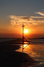 Beautiful sunset over a serene beach, symbolizing the perfect custom getaway.