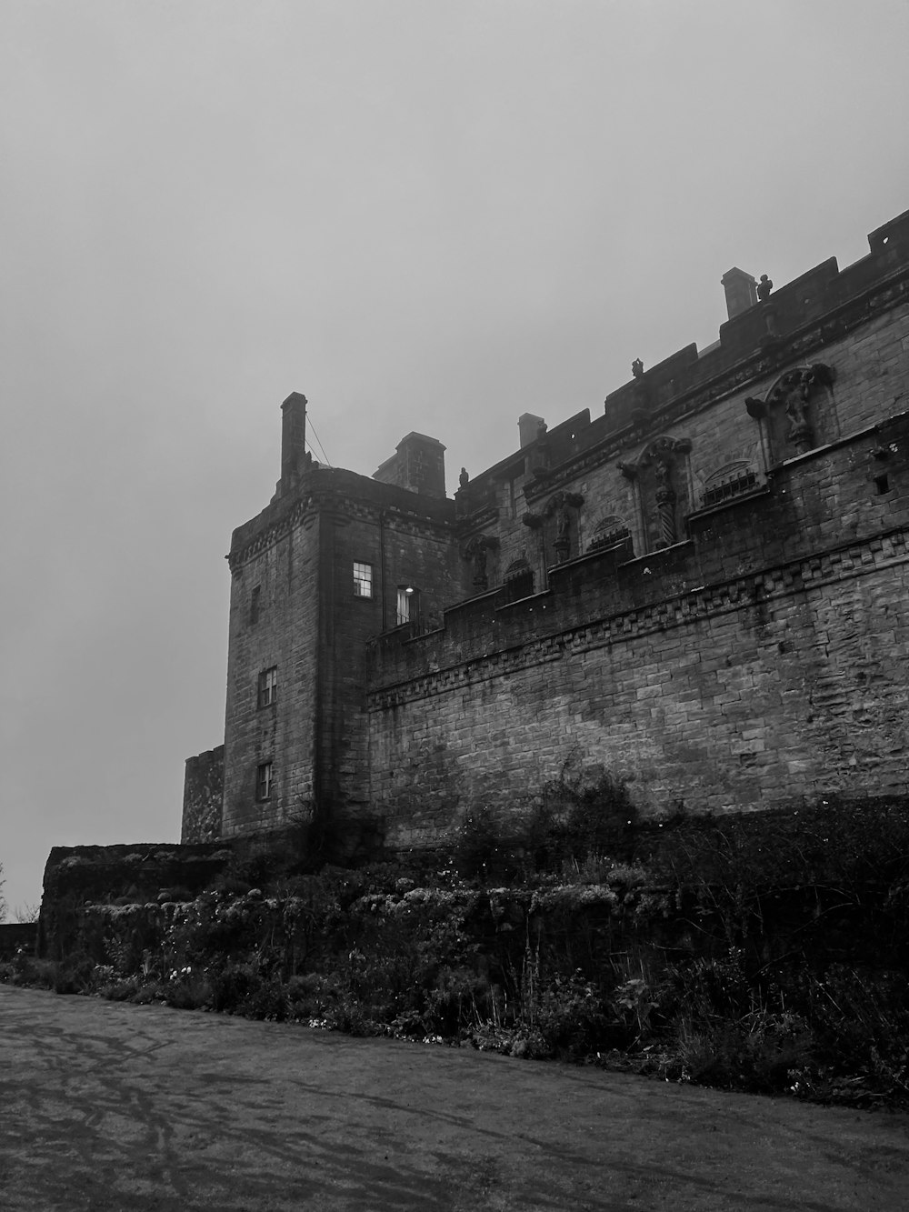 a stone building with a stone wall