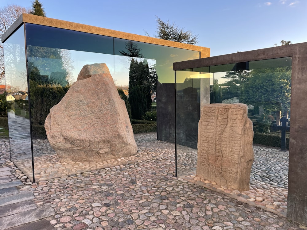 a large rock sculpture outside of a building