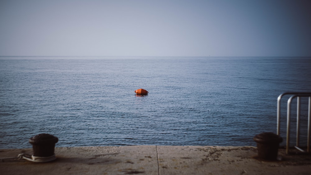 a beach with a body of water in the background