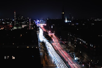 A colorful time-lapse of city traffic flowing through busy streets at night.