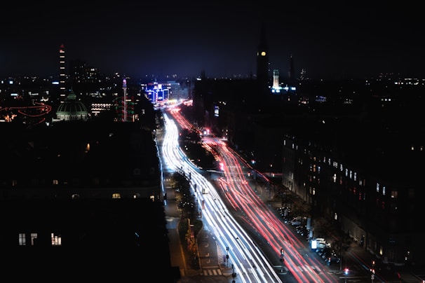 A colorful time-lapse of city traffic flowing through busy streets at night.
