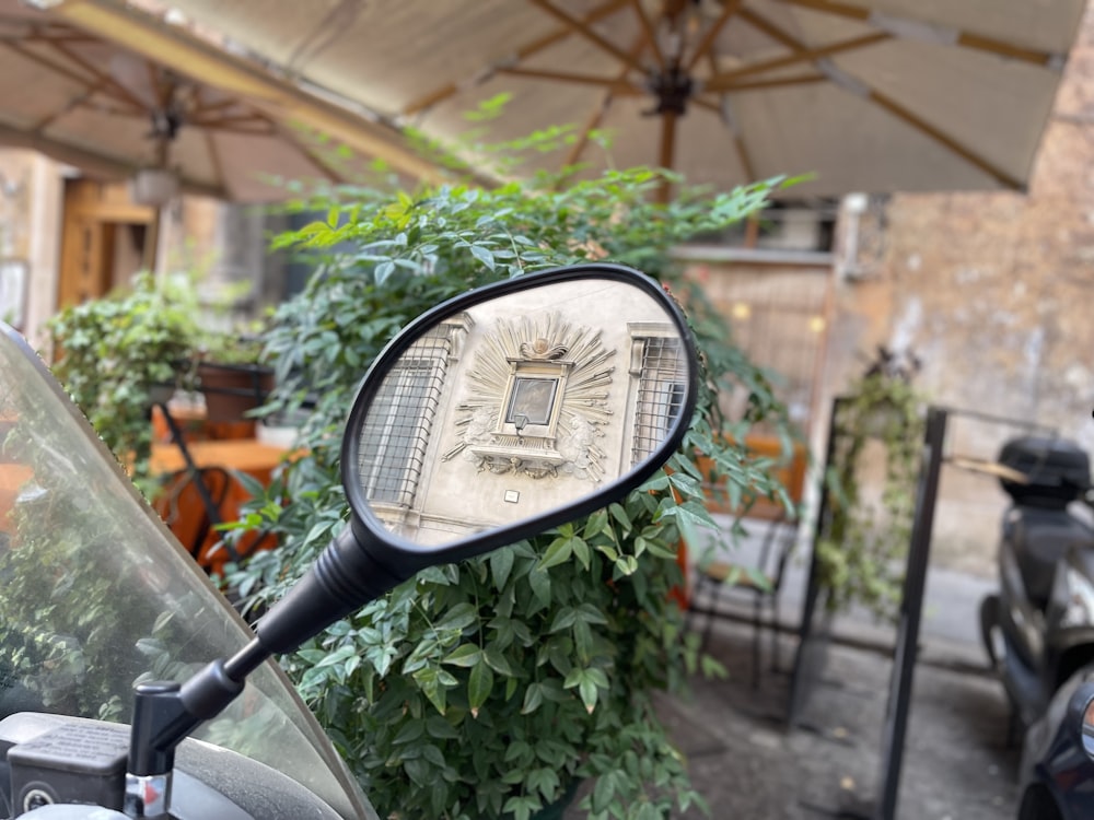 a motorcycle is parked under a covered patio