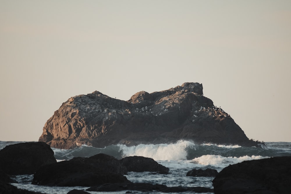 waves crashing against a rock