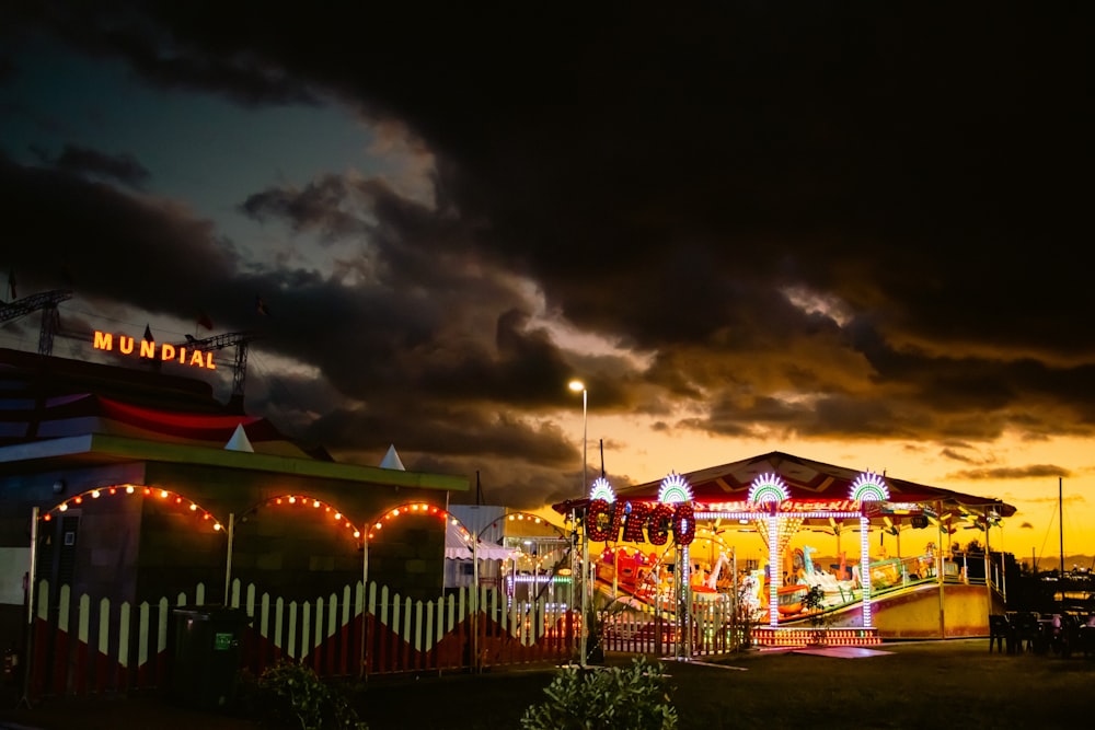 a carnival with a cloudy sky