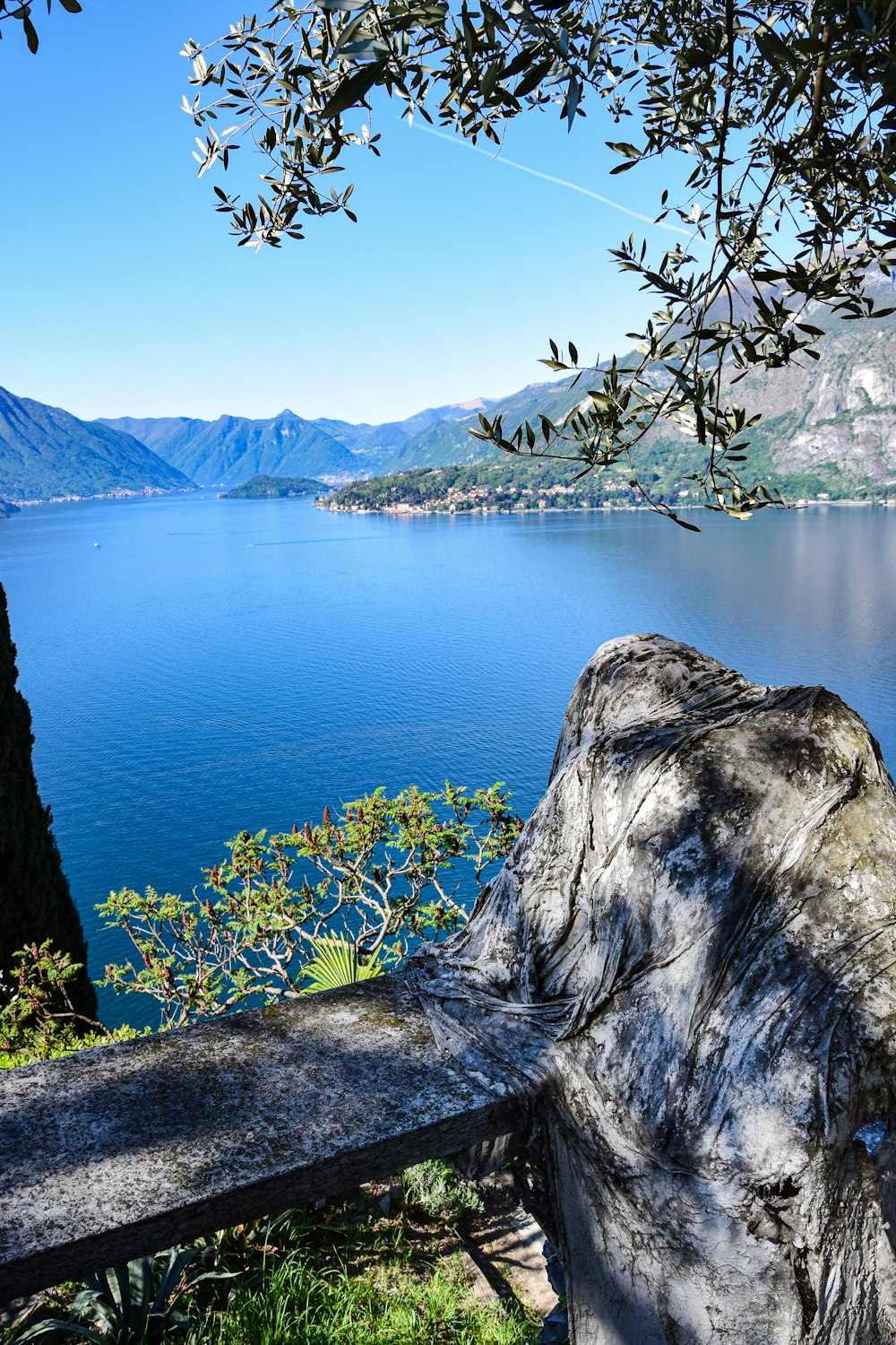 a body of water with mountains in the background