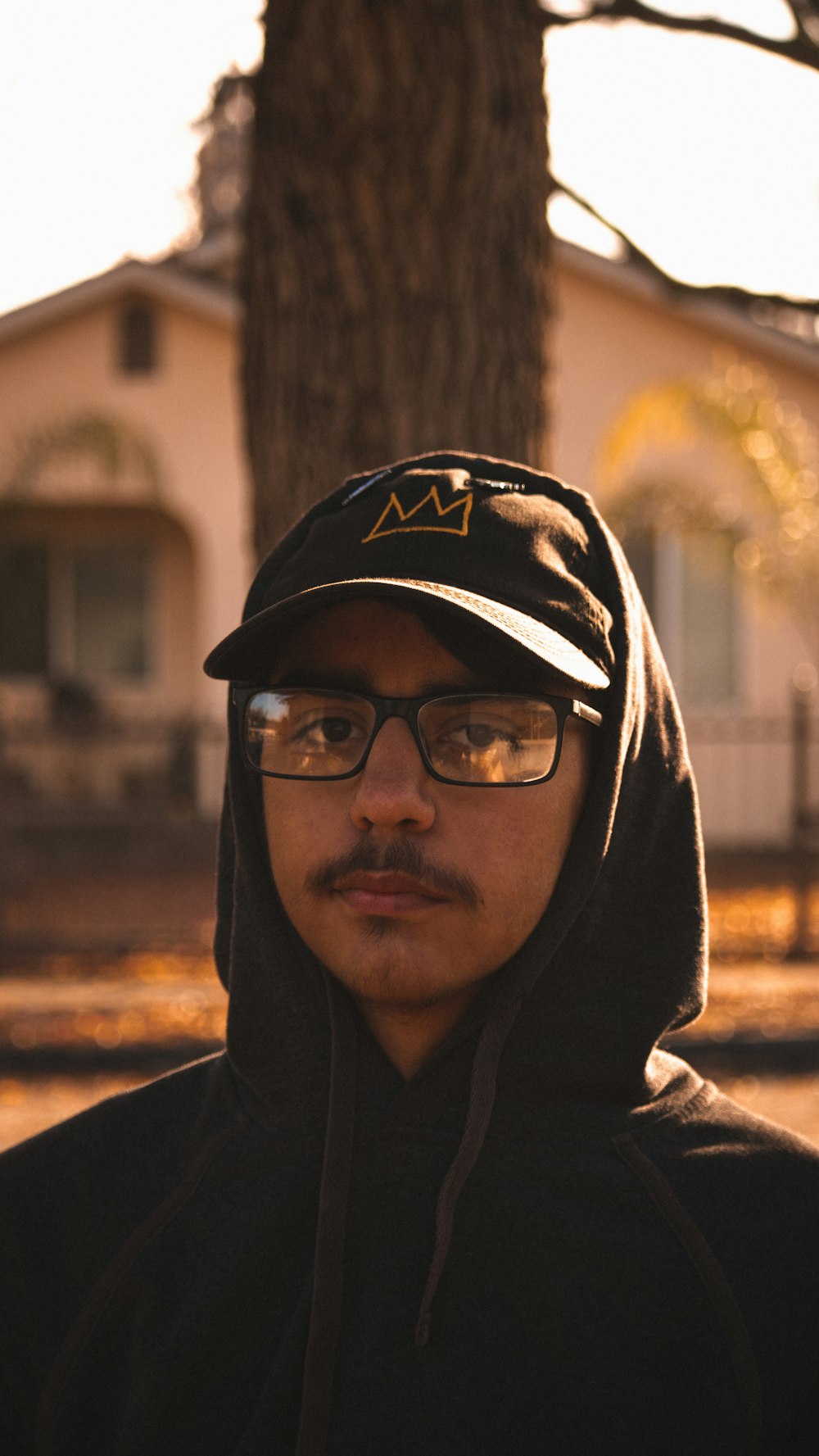 a man wearing a hat and glasses