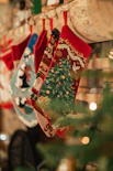 a christmas tree with a red and white cloth from it