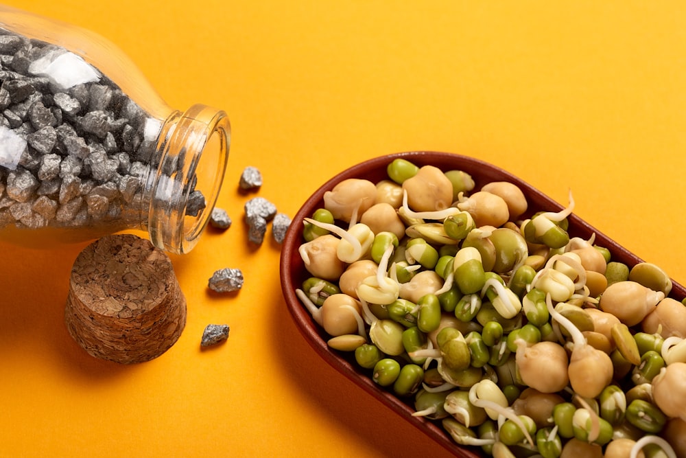 a bowl of nuts and a pineapple