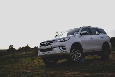 a car parked on a dirt road