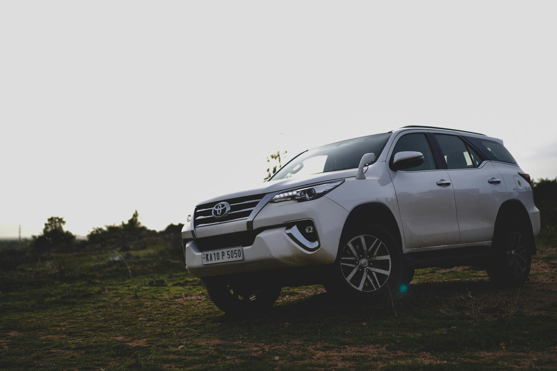 a car parked on a dirt road