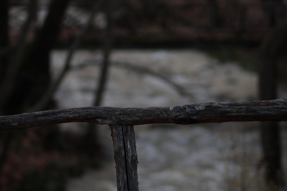 a wooden fence with snow on it