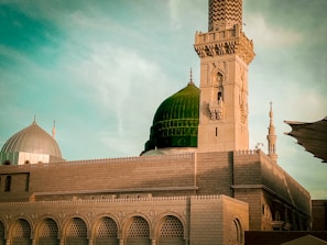 The grand Khalid ibn al-Walid Mosque in Homs with its striking green dome and intricate stonework.