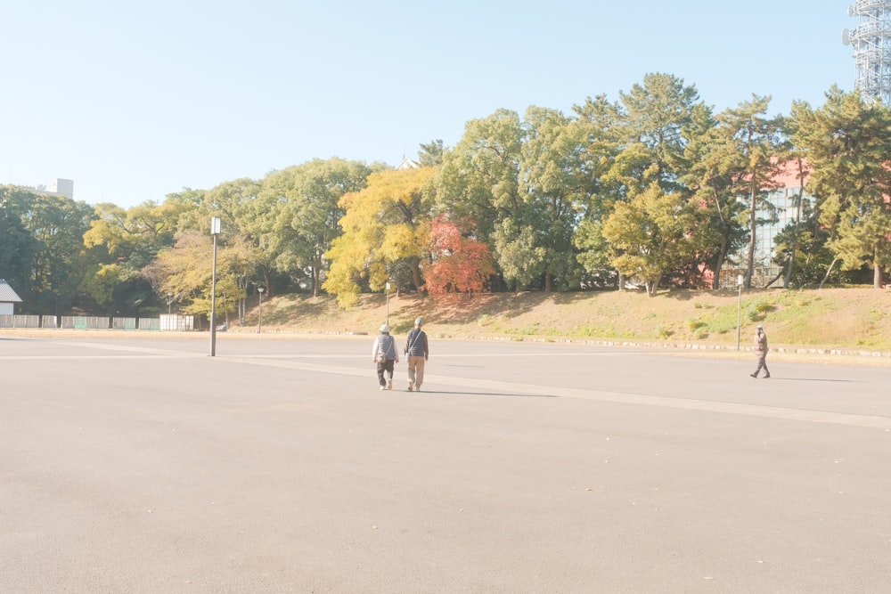 a group of people walking on a road