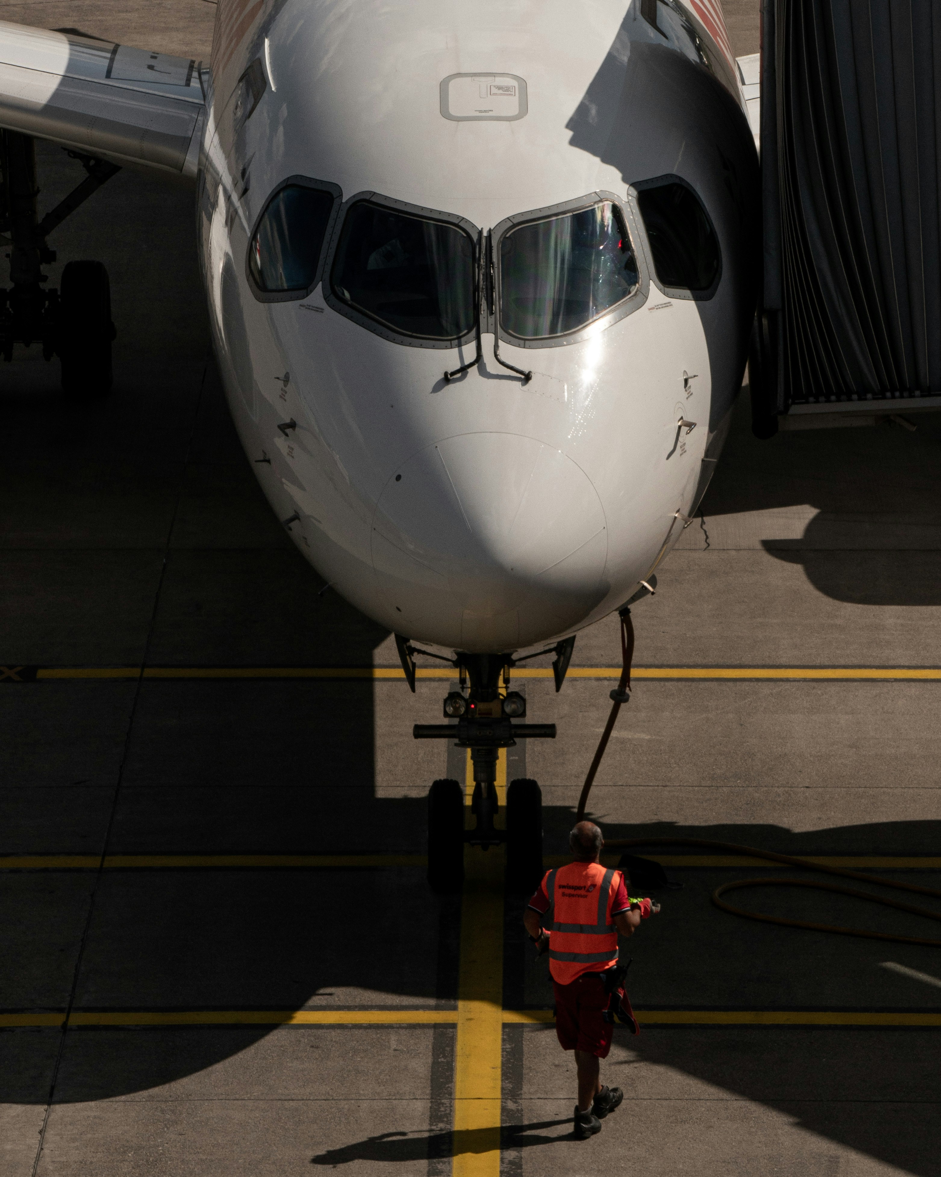 Maintenance crew next to airplane