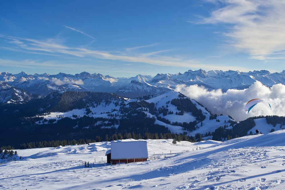 a small building in a snowy landscape