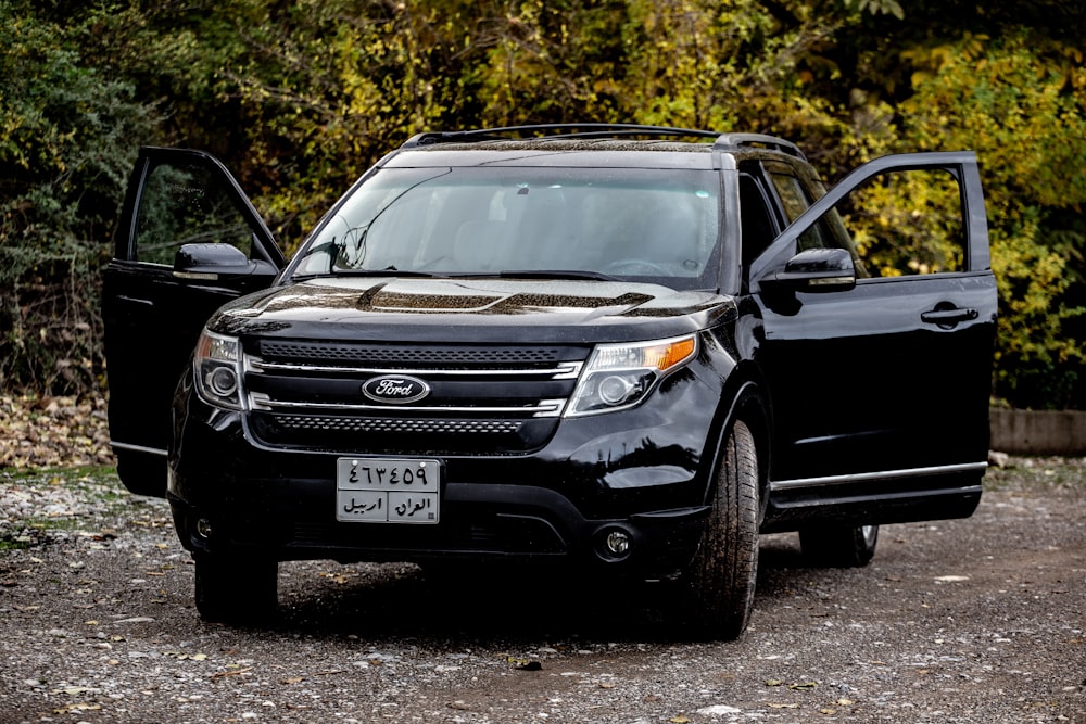 a black car with its doors open