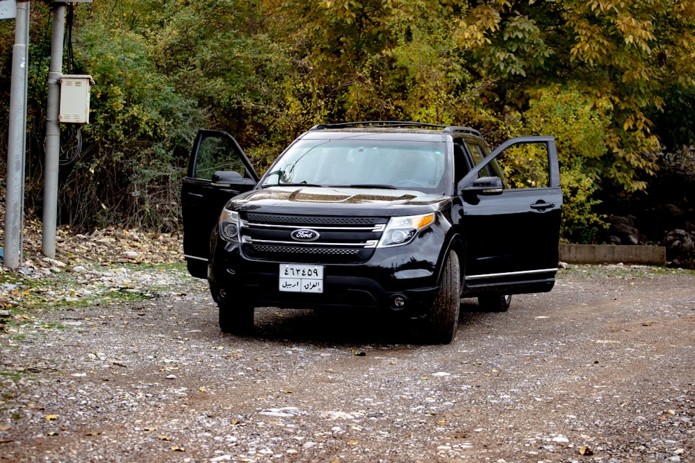 a black car with its doors open