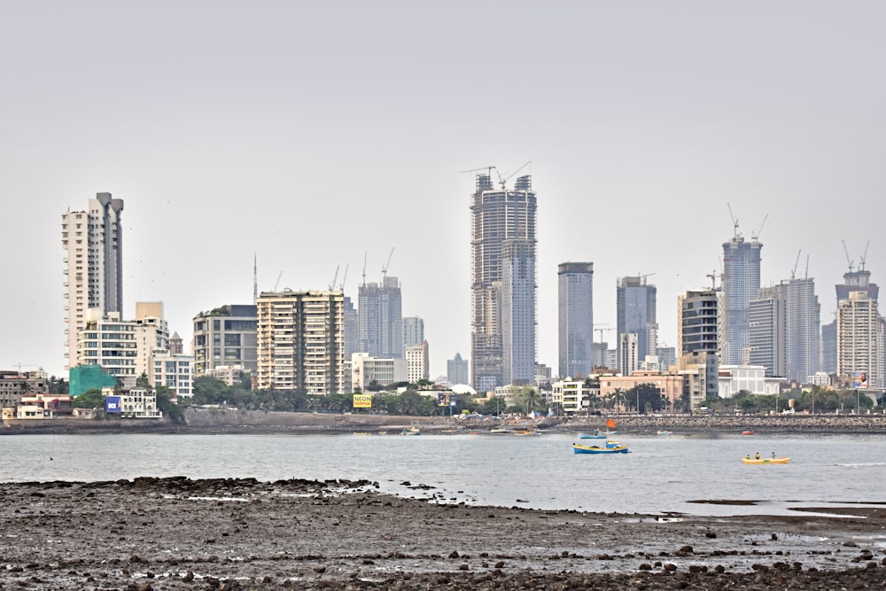 a city skyline with boats