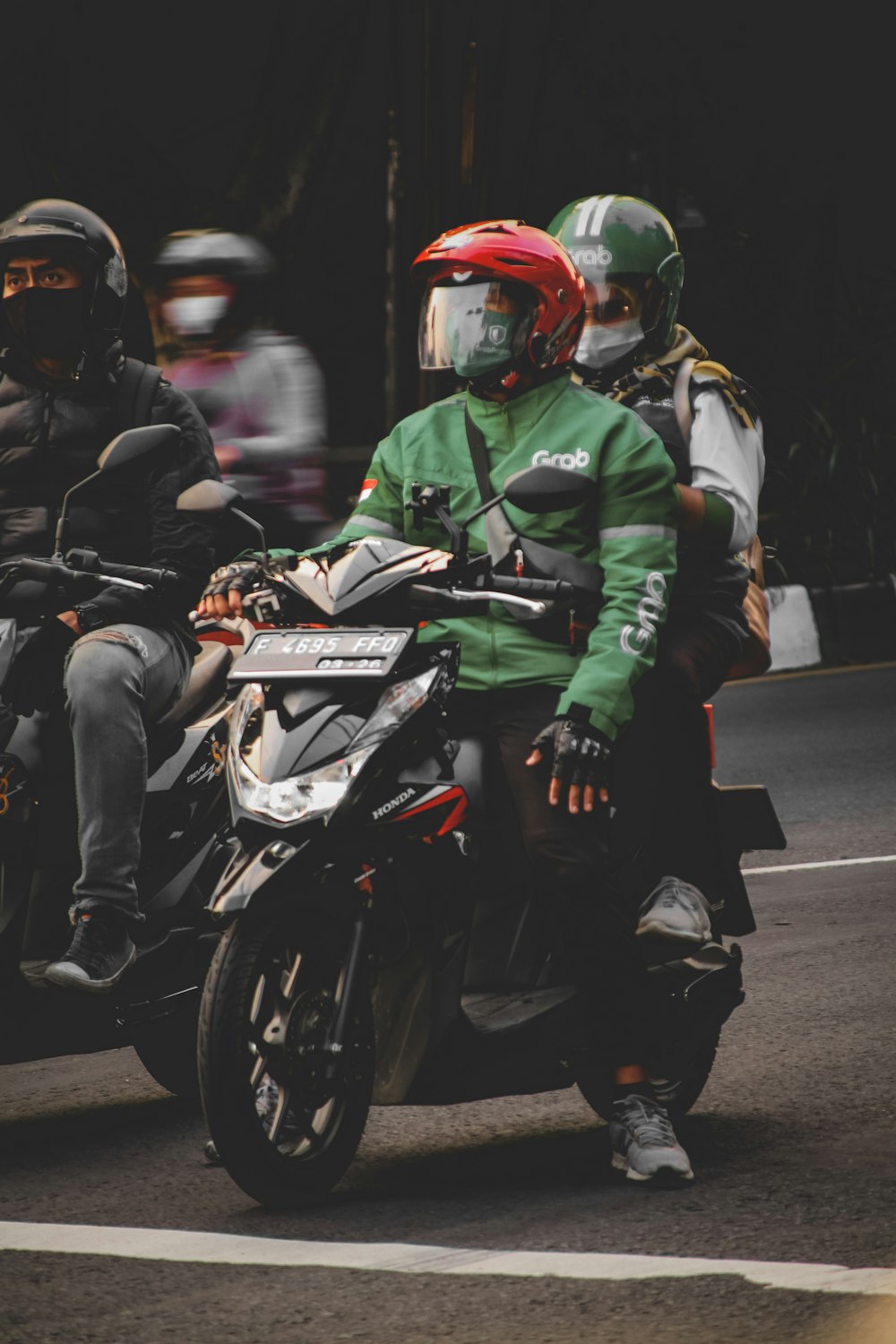 a group of people ride on a motorcycle