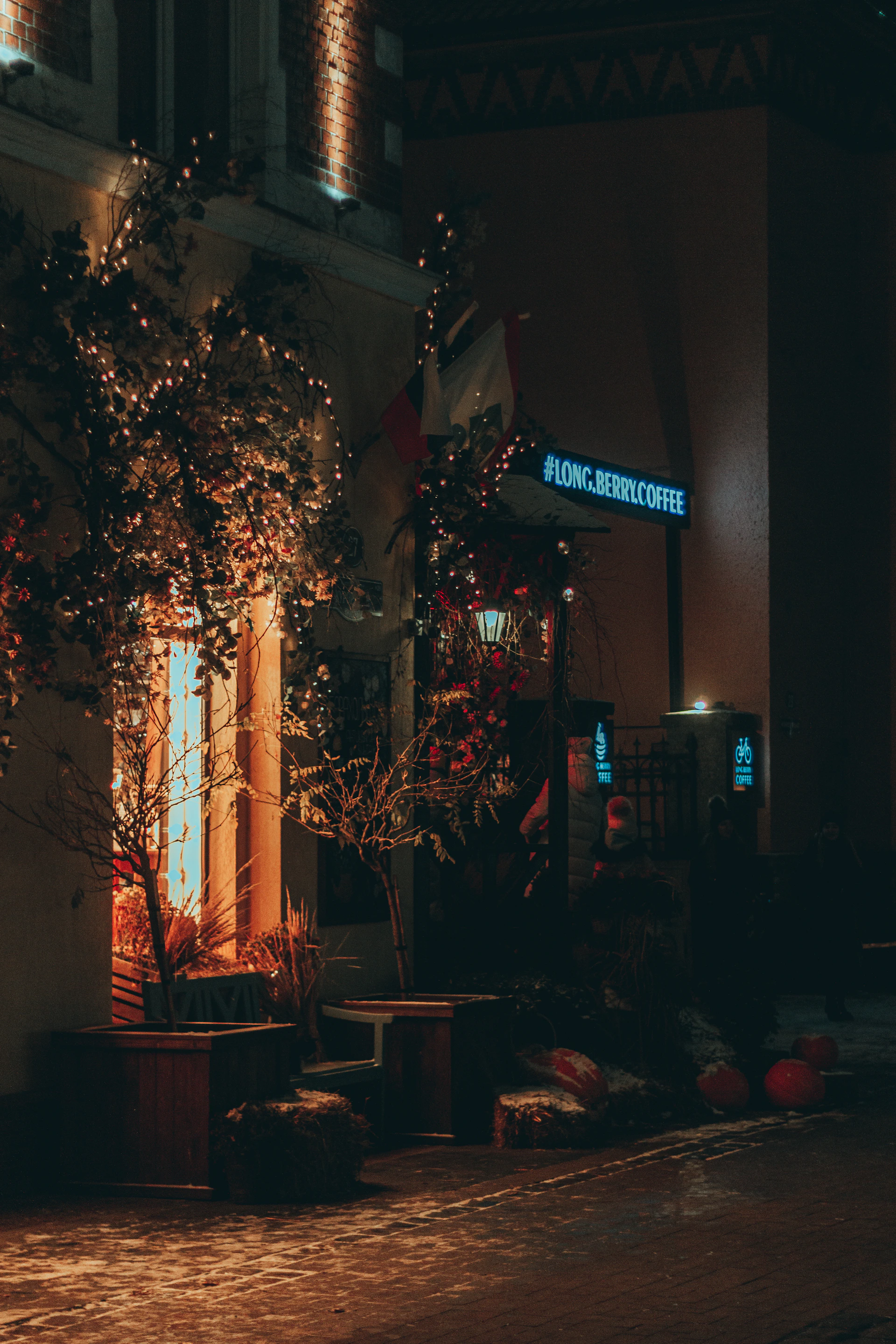 A crisp, vibrant shot of a local coffee shop's storefront glowing warmly in the golden hour light, highlighting Pixelmist's skill in capturing inviting business atmospheres.