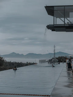 Outdoor infinity pool overlooking a scenic mountain backdrop.