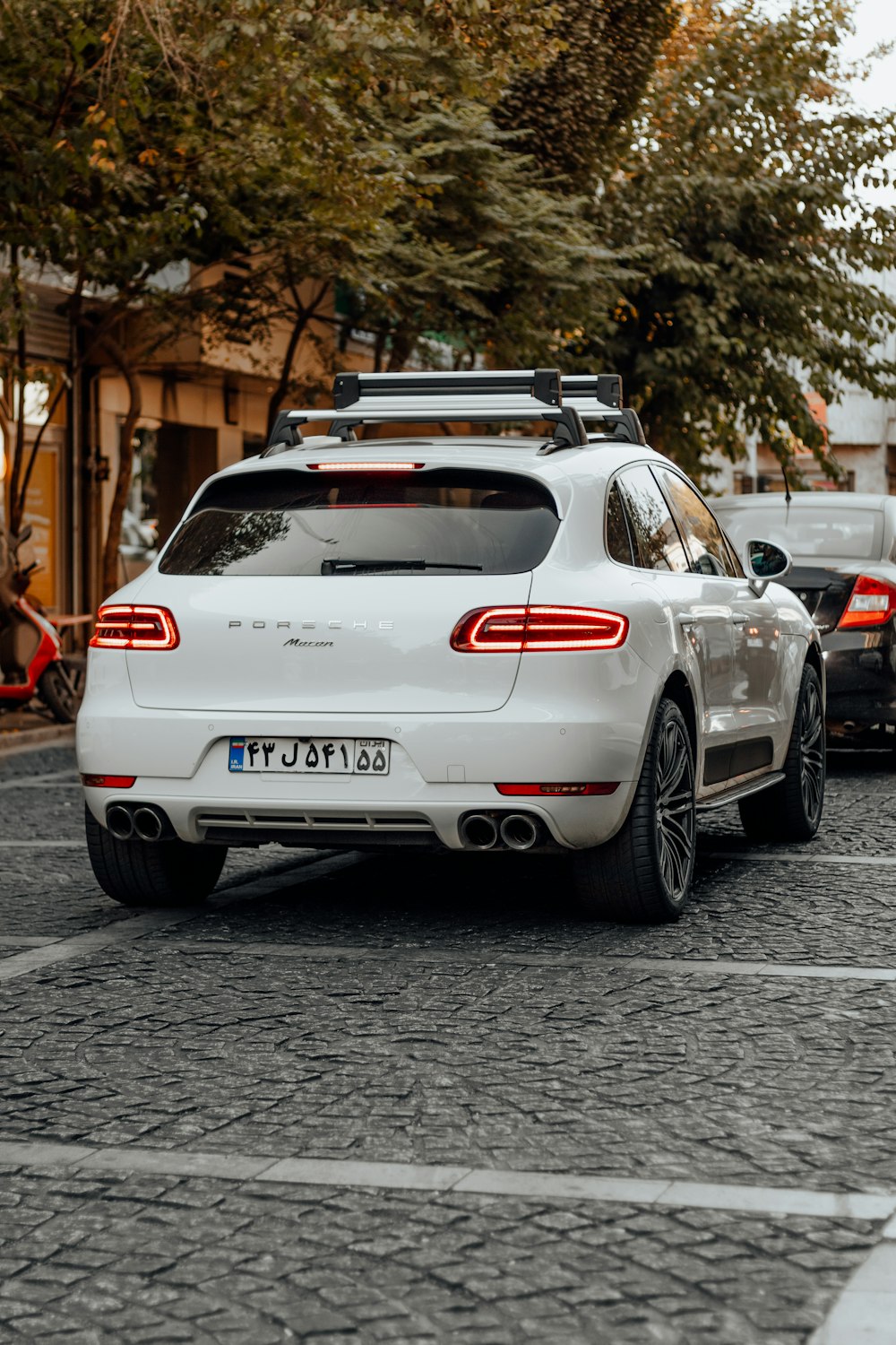 a white car parked on a street