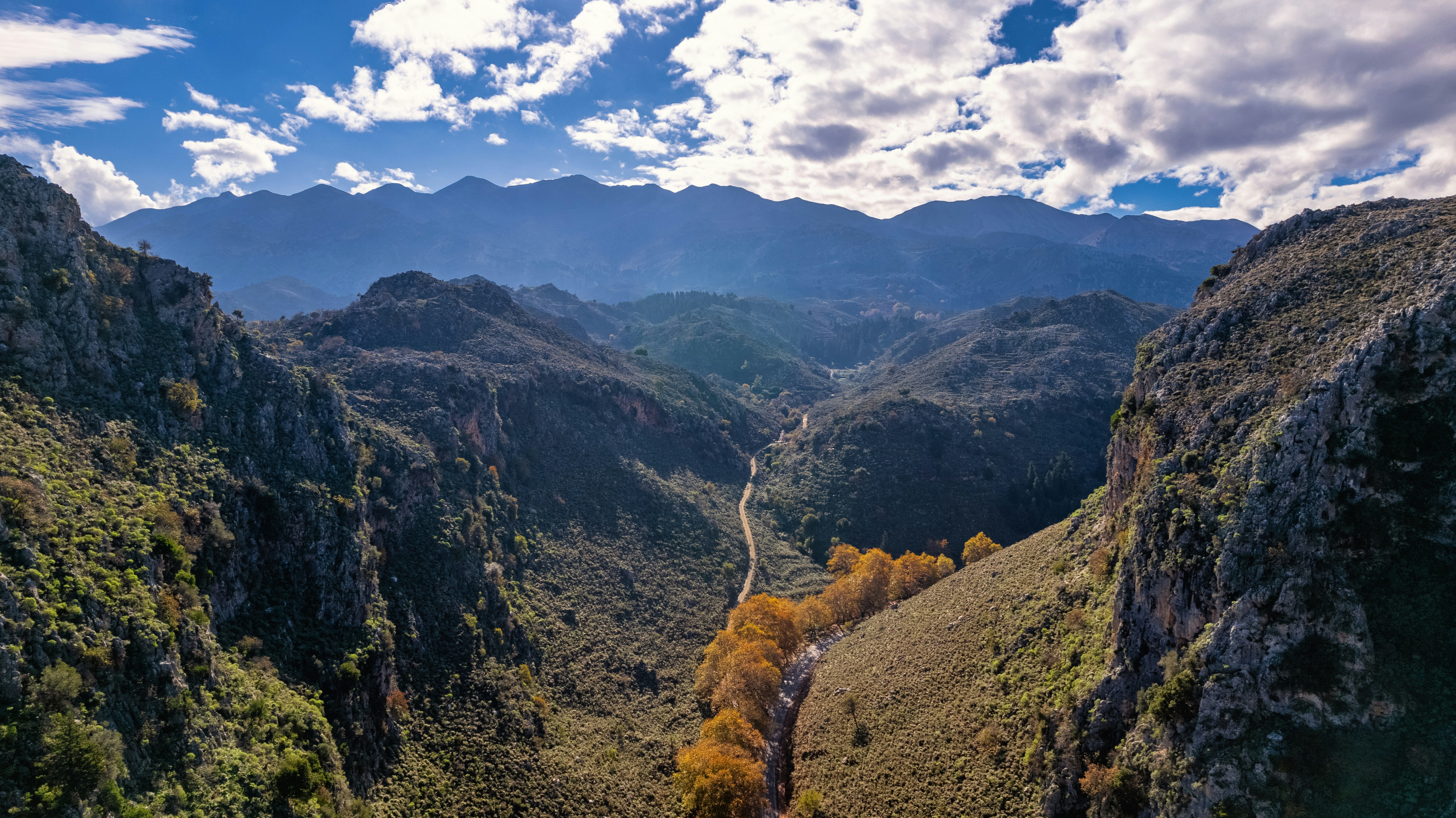 a winding road through a valley