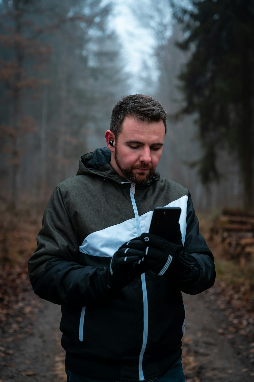 a man holding a book and a camera