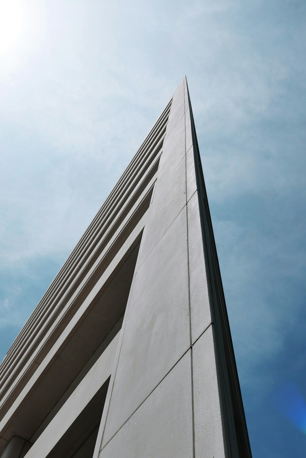 a tall building with a blue sky