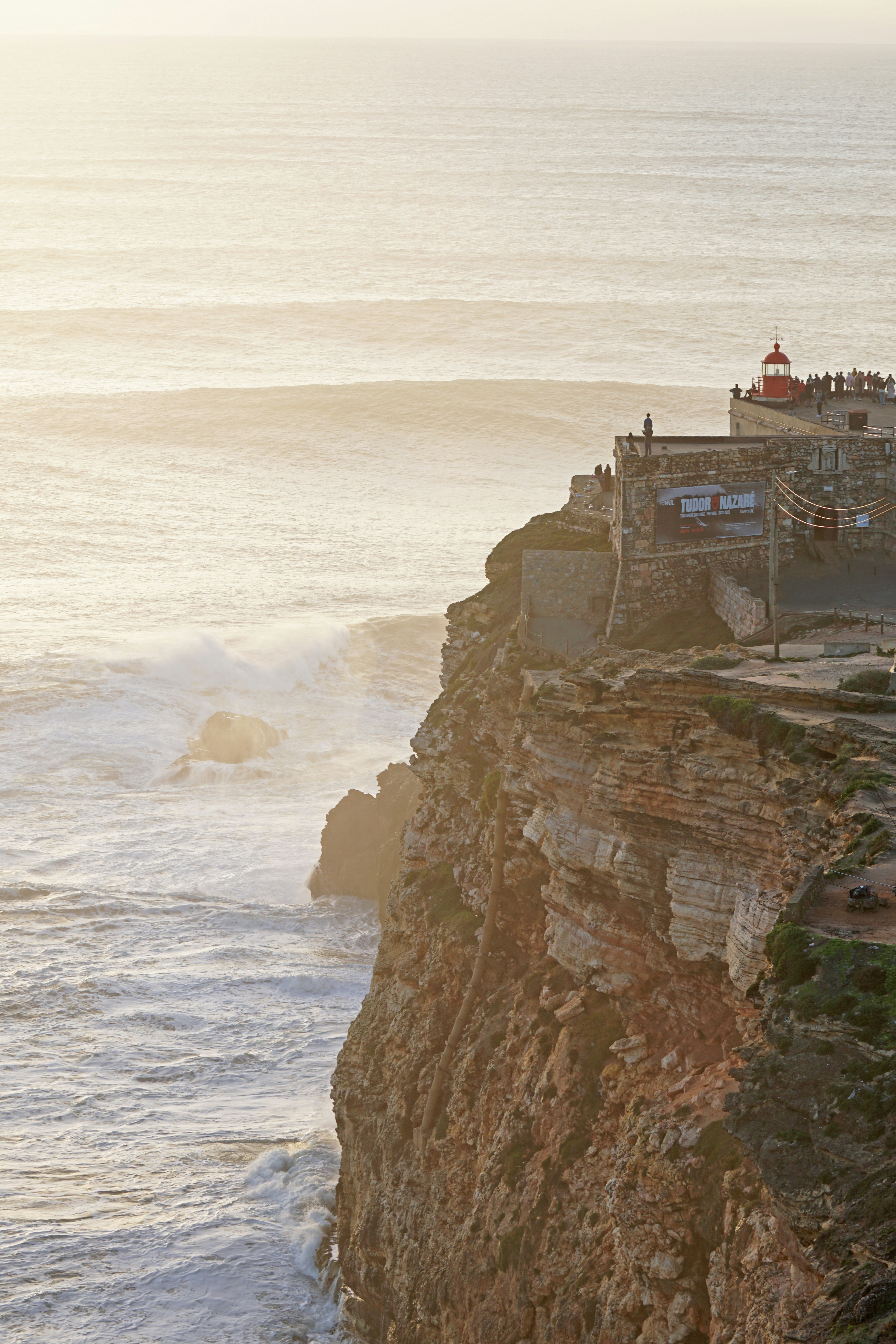 Nazaré lighthouse on dramatic cliffs above the Atlantic Ocean