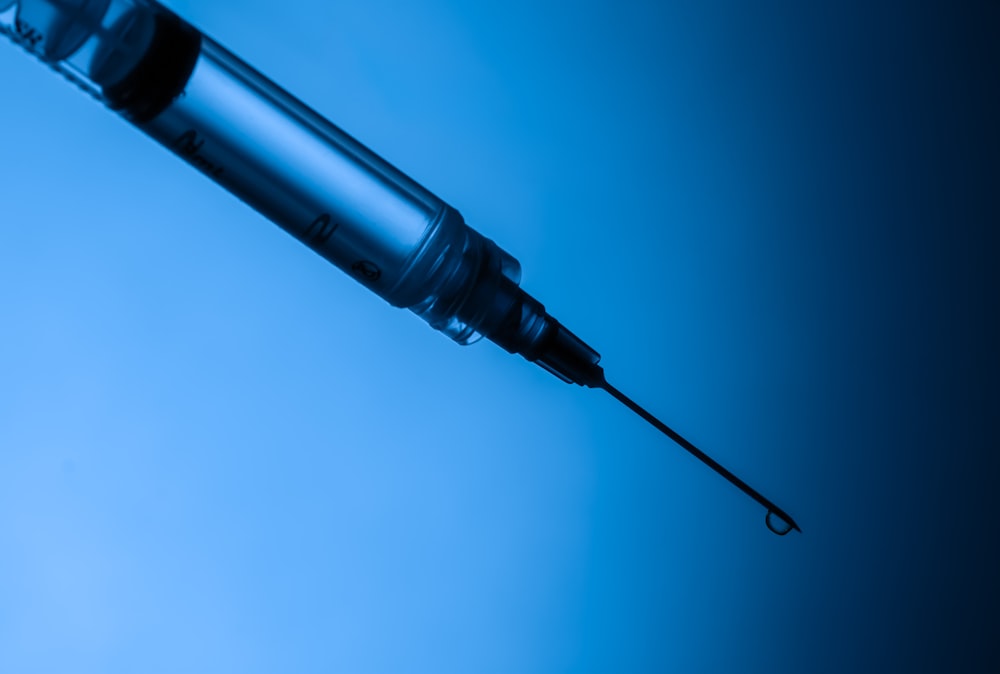 a close-up of a syringe